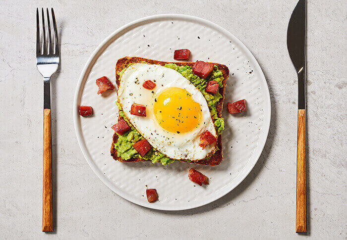 Avocado-Toast-with-Egg-and-Crispy-Pancetta-on-Country-Grain-700.jpg
